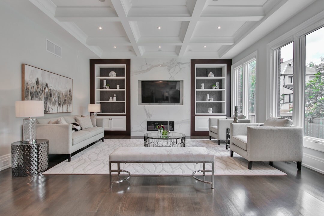Elegant celebrity-style living room with mid-century furniture and large windows