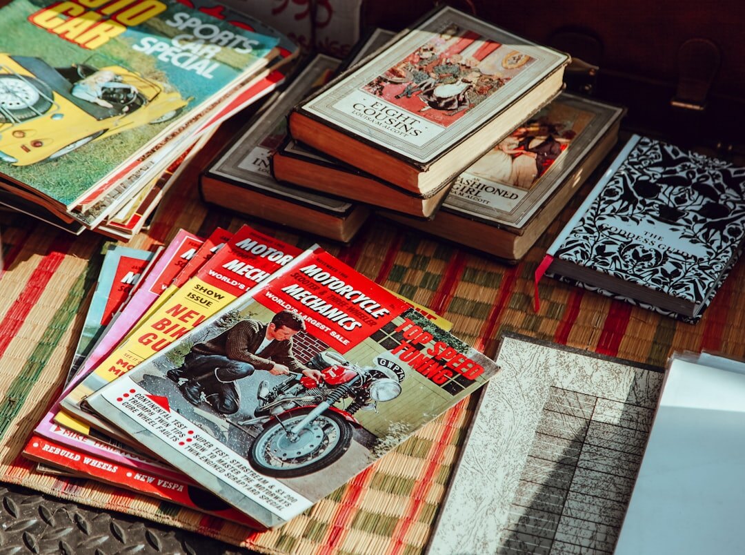 Editorial archive shelf with vintage magazines and an old film camera
